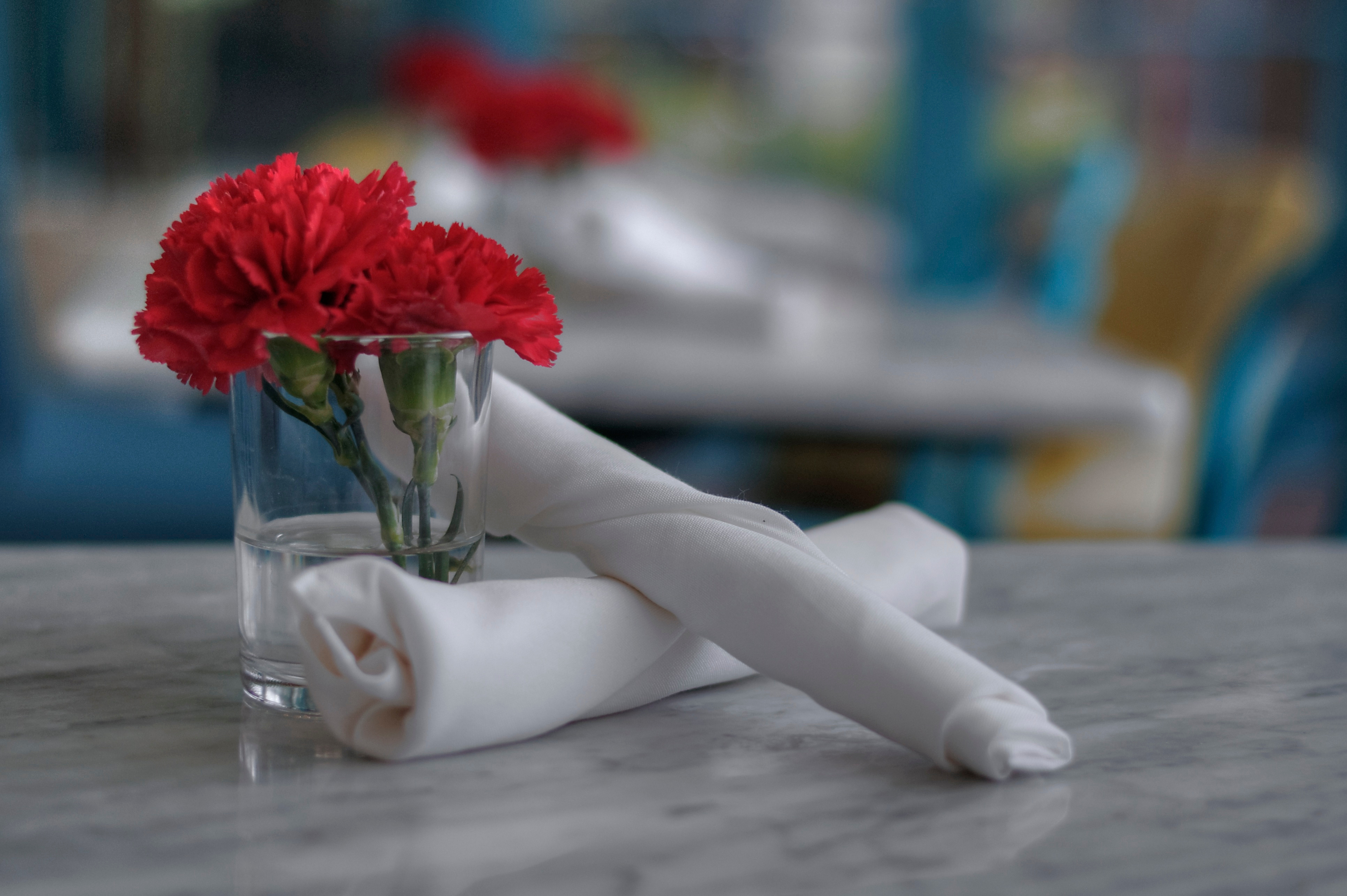 Formal silverware at an empty table.